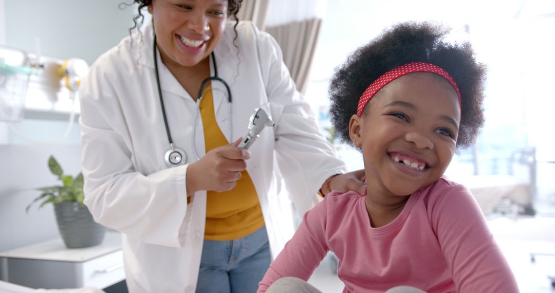 Pediatric Doctor Smiling with Happy Child Patient in Modern Clinic - Free Images, Stock Photos and Pictures on Pikwizard.com