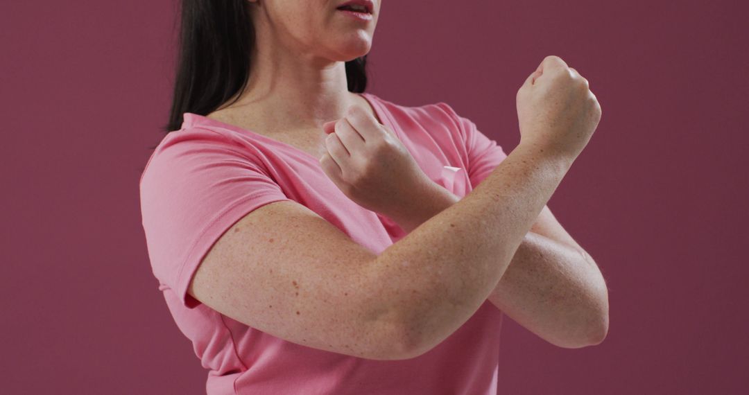 Woman Practicing Self-Defense Techniques Against Pink Background - Free Images, Stock Photos and Pictures on Pikwizard.com