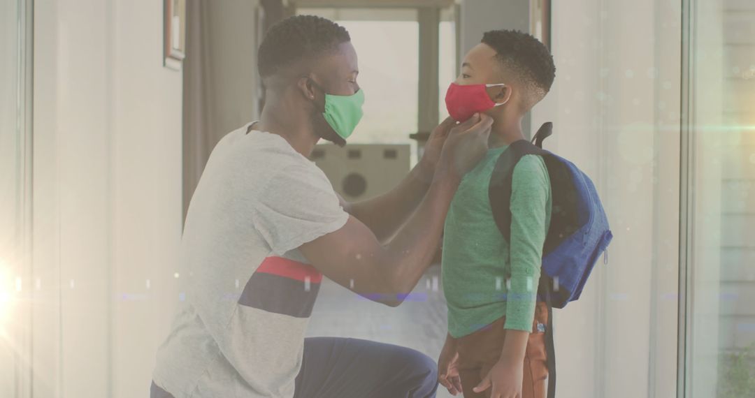 Father Preparing Son with Face Mask for School