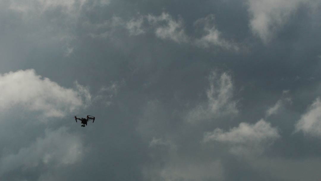 Drone Flying Against Moody Cloudy Sky - Free Images, Stock Photos and Pictures on Pikwizard.com