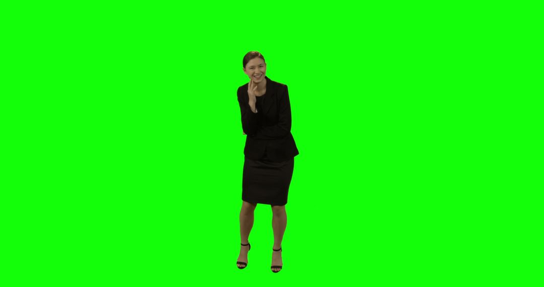 Businesswoman Laughing and Standing Against Green Screen - Free Images, Stock Photos and Pictures on Pikwizard.com