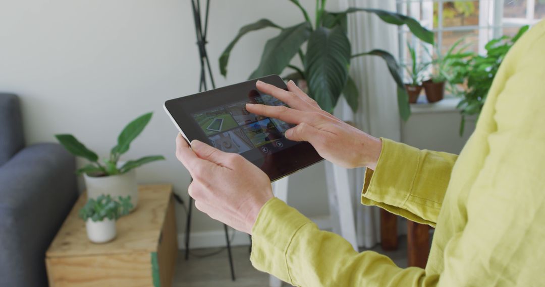 Close-up of person using tablet with home automation app indoors - Free Images, Stock Photos and Pictures on Pikwizard.com