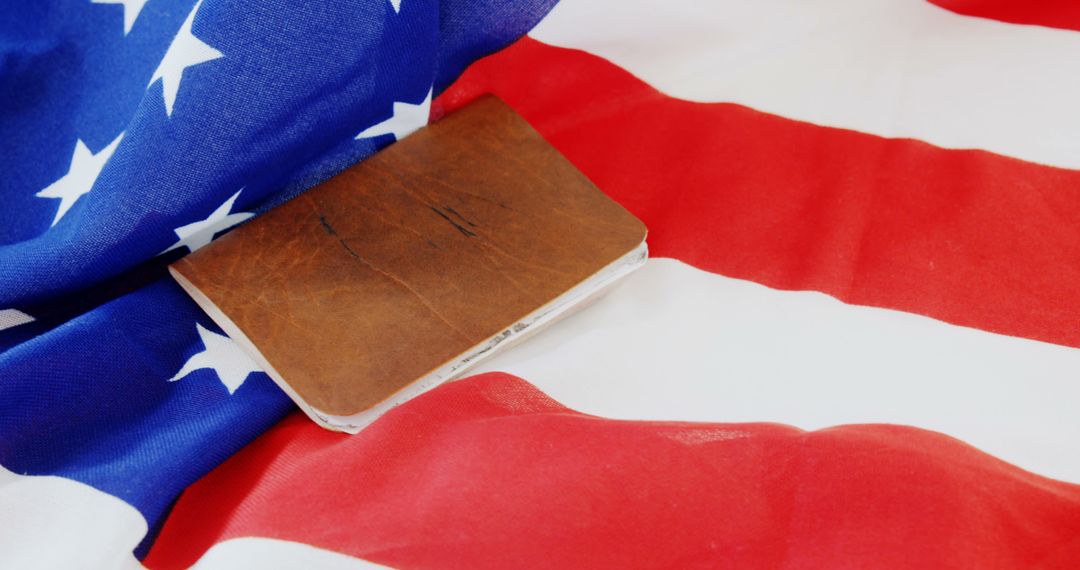 An old book on the American flag evokes patriotism and respect for U.S. heritage. - Free Images, Stock Photos and Pictures on Pikwizard.com