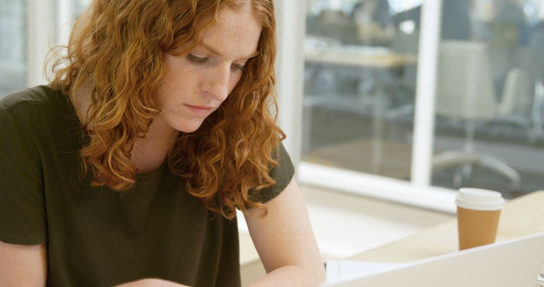 Focused Young Woman Studying in Library - Free Images, Stock Photos and Pictures on Pikwizard.com