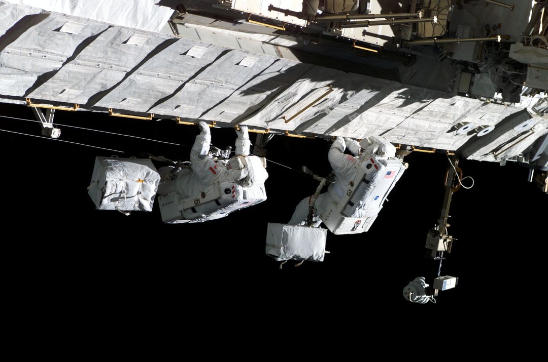 MacLean and Burbank performing second EVA spacewalk - Free Images, Stock Photos and Pictures on Pikwizard.com