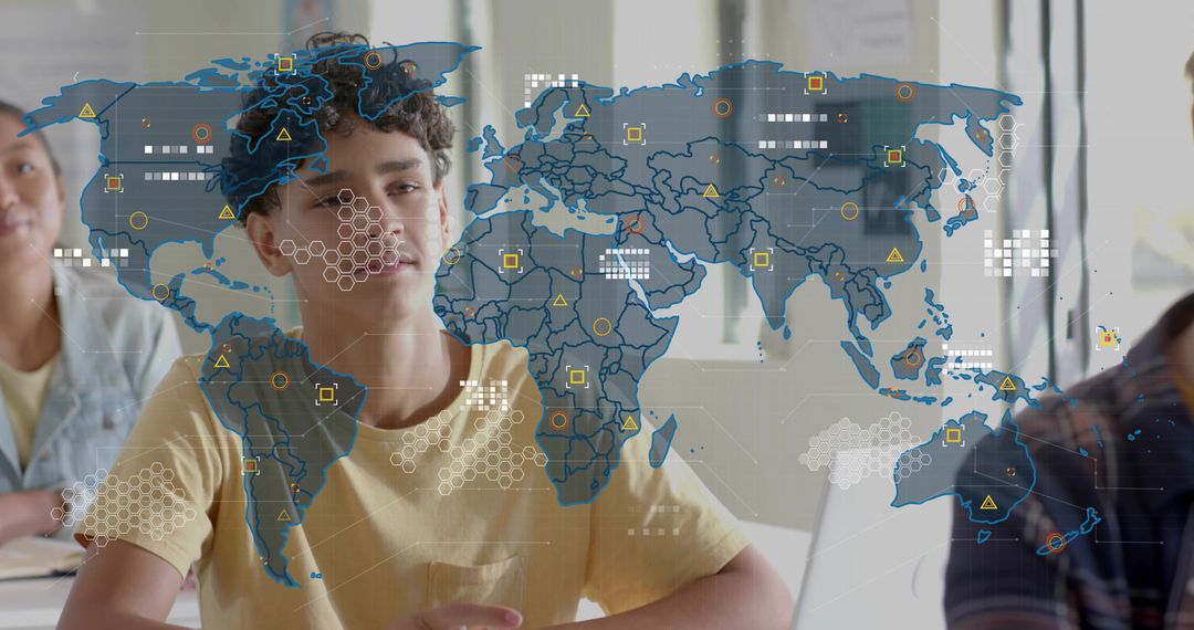 Teenage student studying with interactive world map overlay on laptop in classroom