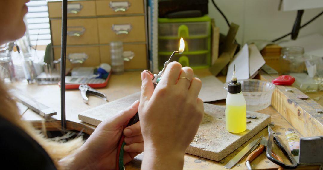 Caucasian Artisan Using Torch in Jewelry Crafting Workshop - Free Images, Stock Photos and Pictures on Pikwizard.com