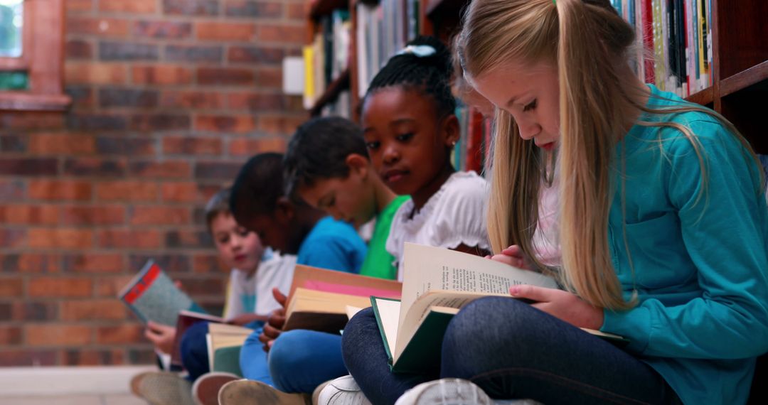 Diverse Group of Students Immersed in Books in School Library