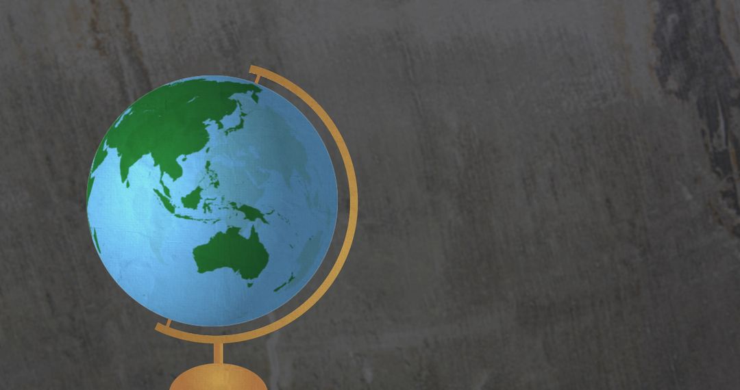 Spinning Globe Against Gray Background