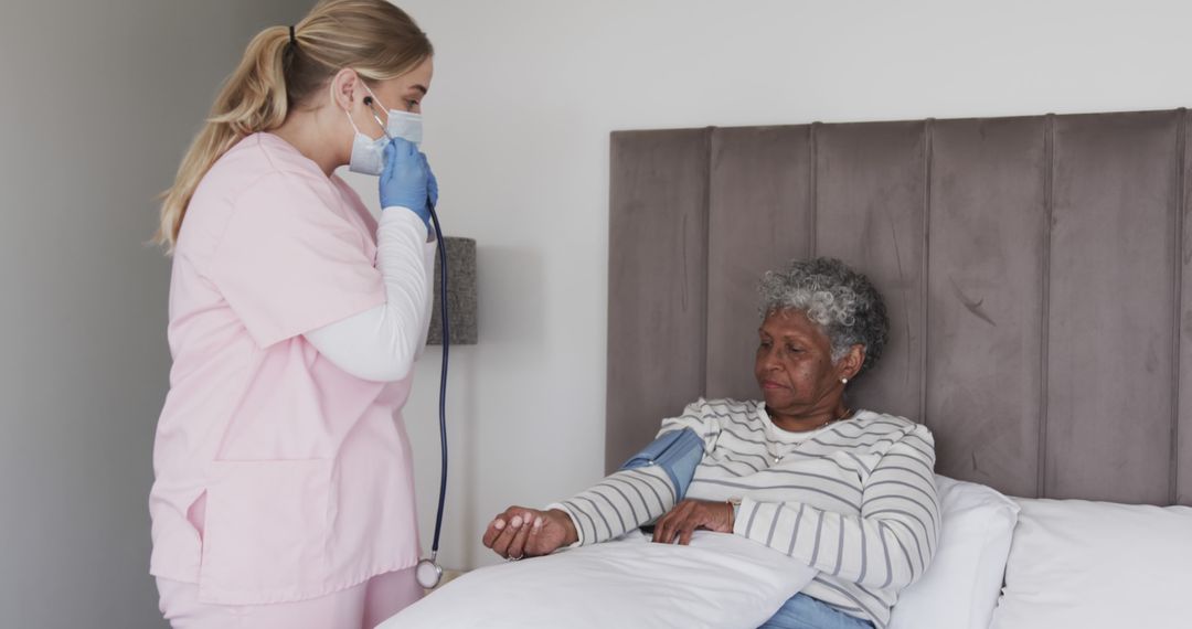 Nurse Checking Blood Pressure of Elderly Woman at Home - Free Images, Stock Photos and Pictures on Pikwizard.com