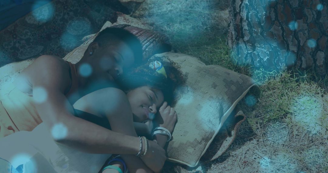 Mother and Daughter Relaxing Under Tree in Peaceful Moment