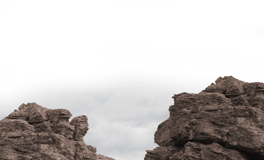 Transparent Rocky Landscape with Cloudy Sky Backdrop