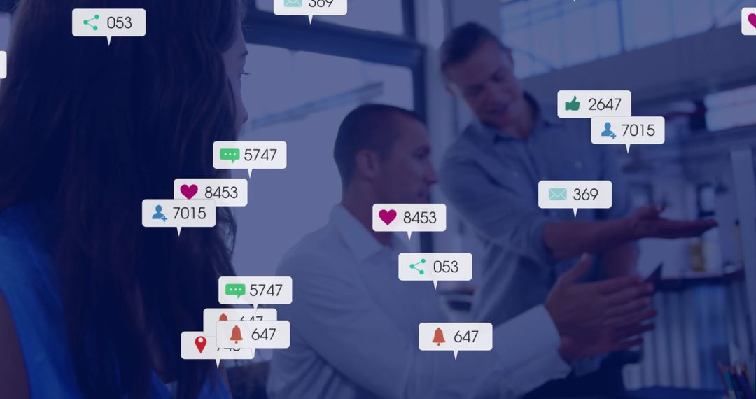 Business Colleagues Engaging in Discussion with Social Media Graphics