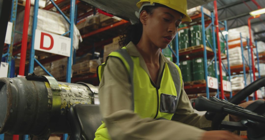 Female Warehouse Worker Operating Forklift, Ensuring Safety - Free Images, Stock Photos and Pictures on Pikwizard.com