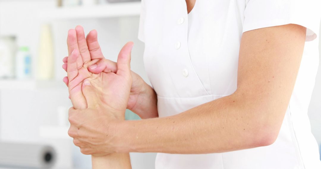 Physiotherapist Giving Hand Therapy to Patient - Free Images, Stock Photos and Pictures on Pikwizard.com