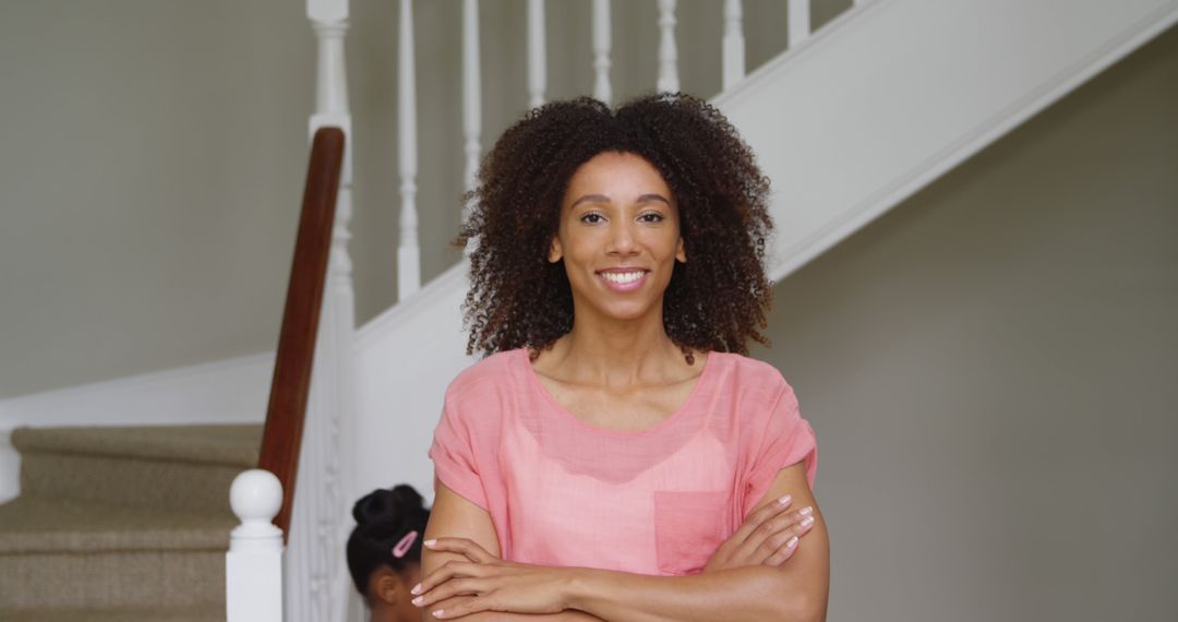 Confident African American Woman Standing with Arms Crossed at Home - Free Images, Stock Photos and Pictures on Pikwizard.com