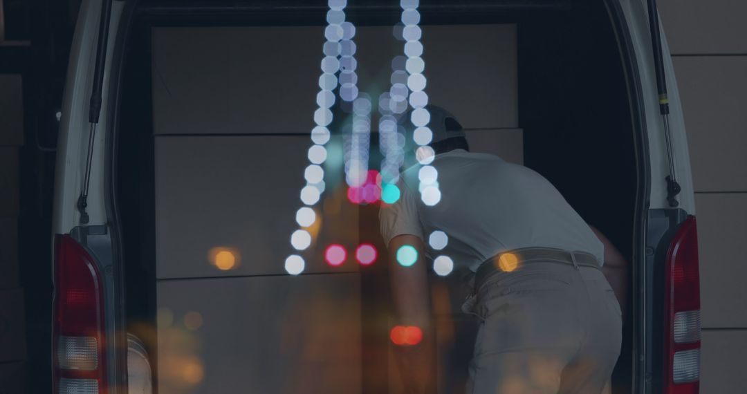 Nighttime Double Exposure of Driver Unloading Boxes