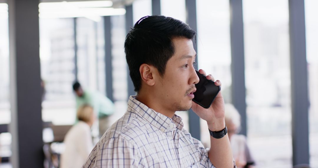 Focused Business Professional Engaged in Phone Conversation