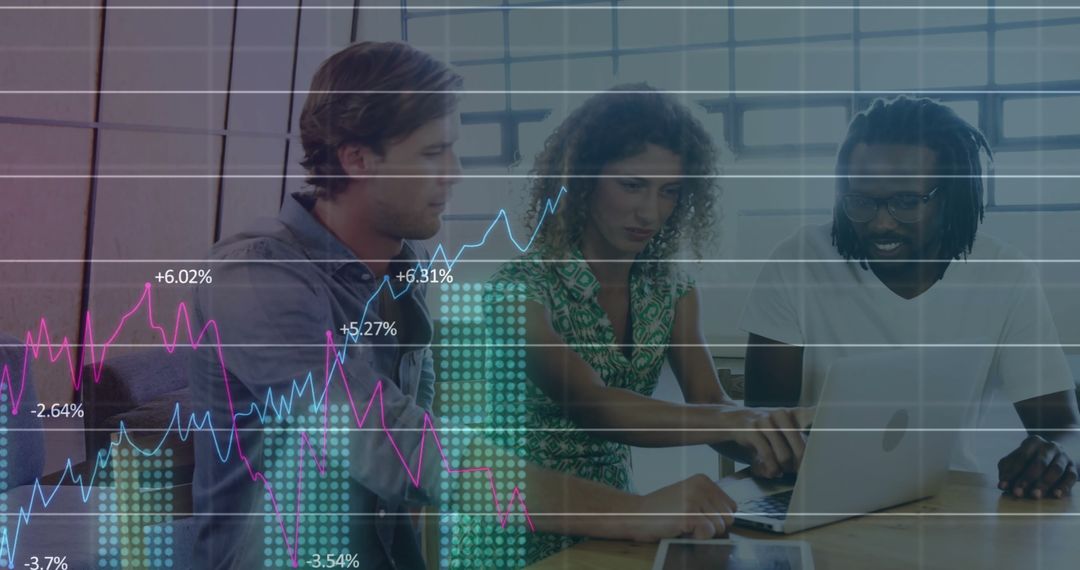 Diverse Team Analyzing Financial Data and Graphs in Office