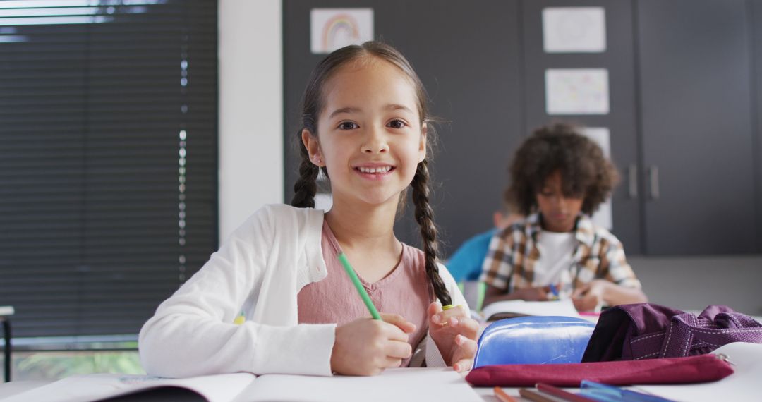 Smiling Schoolgirl with Braids Drawing in Classroom - Free Images, Stock Photos and Pictures on Pikwizard.com