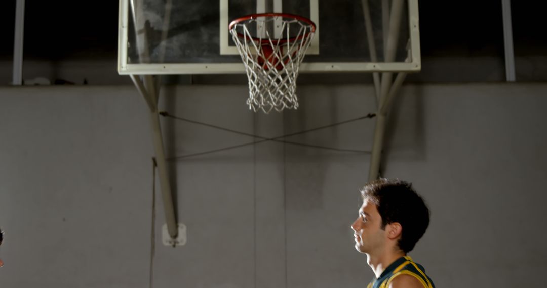 Basketball Player Getting Ready to Take a Shot at Indoor Court - Free Images, Stock Photos and Pictures on Pikwizard.com