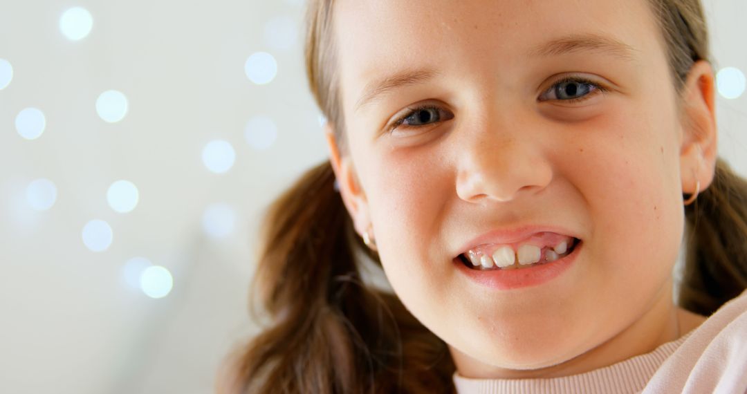 Smiling Girl with Pigtails Close-Up - Free Images, Stock Photos and Pictures on Pikwizard.com