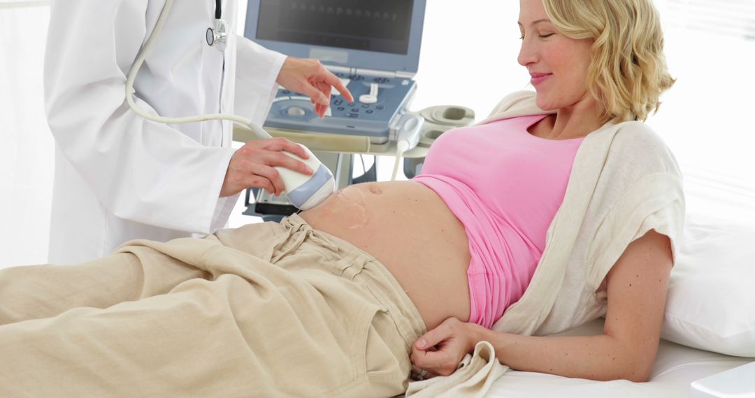 Pregnant Woman Receiving Ultrasound Examination by Doctor - Free Images, Stock Photos and Pictures on Pikwizard.com