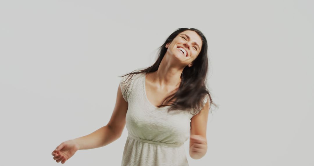 Joyful Woman Laughing and Wearing Casual Clothing on White Background - Free Images, Stock Photos and Pictures on Pikwizard.com