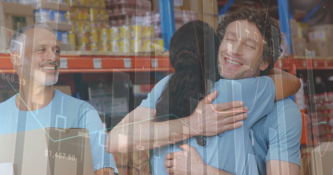 Volunteers Hugging Amid Data Visualization in Warehouse