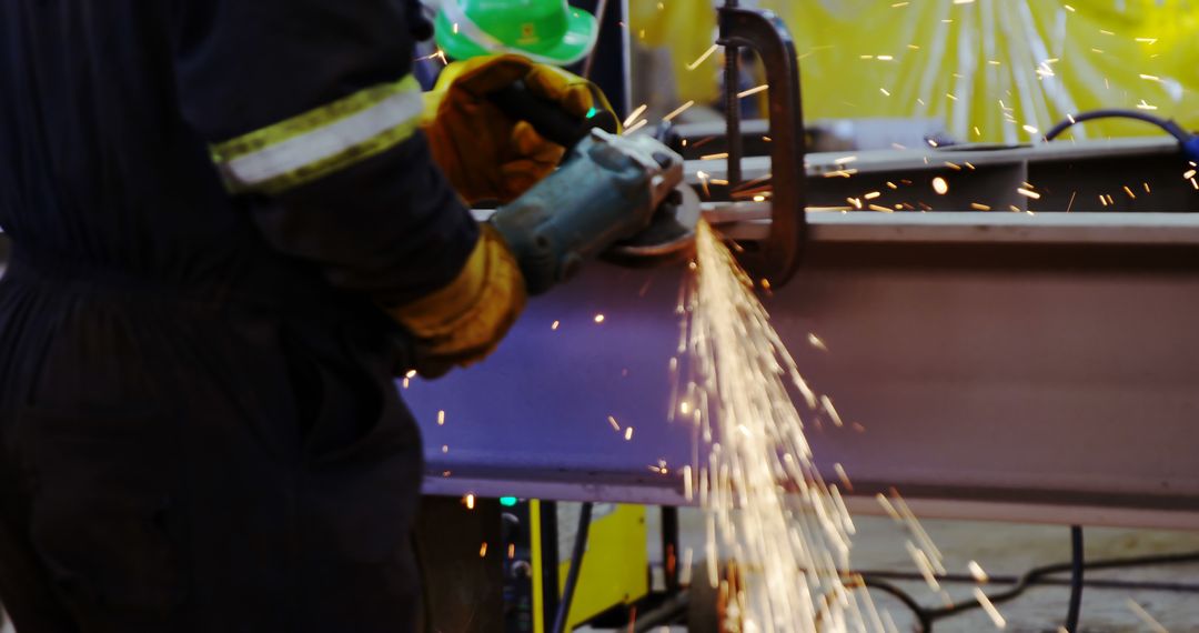 Industrial Worker Grinding Metal Beam with Sparks Flying - Free Images, Stock Photos and Pictures on Pikwizard.com