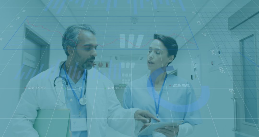 Doctors Analyzing Data in Hospital Corridor