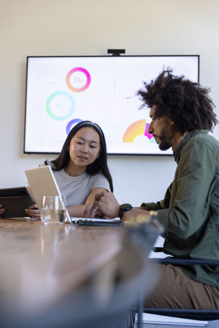 Diverse Team Collaborating on Business Strategy in Conference Room