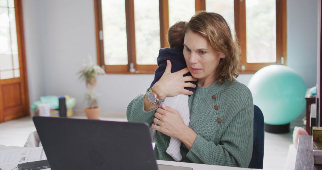 Image of caucasian mother working on laptop from home with newborn baby - Free Images, Stock Photos and Pictures on Pikwizard.com