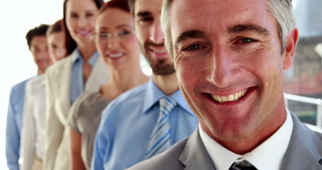 Smiling Professional Business Team in Office Corridor - Free Images, Stock Photos and Pictures on Pikwizard.com