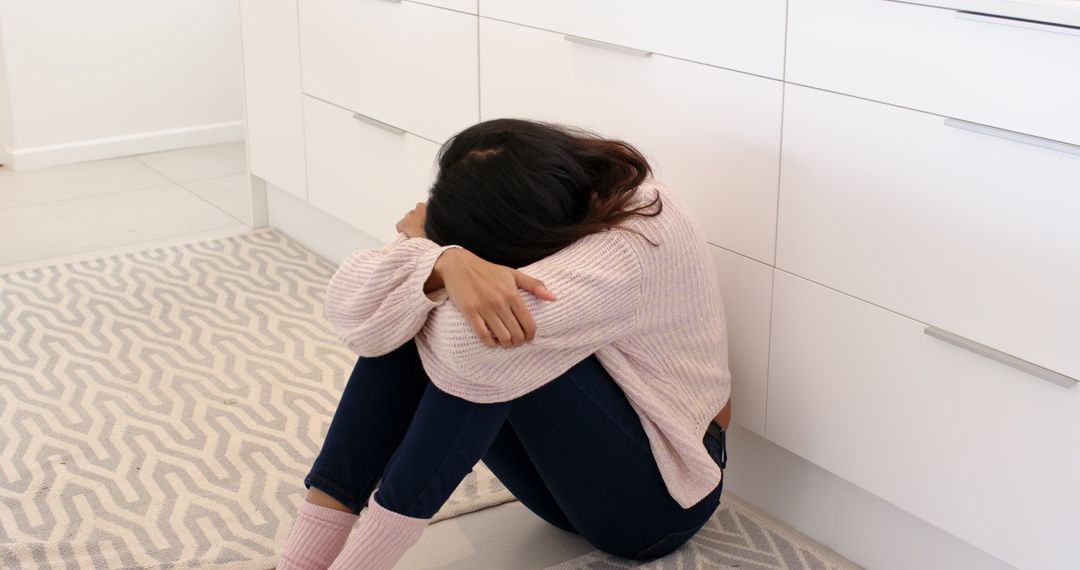 Woman Contemplating in Modern Minimalist Kitchen at Home