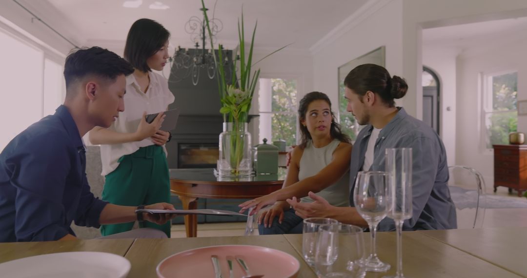 Couple and Wedding Planner Discussing Event Details at Home