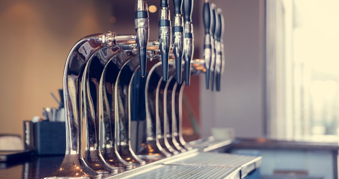 Close-Up of Beer Taps in Traditional Bar