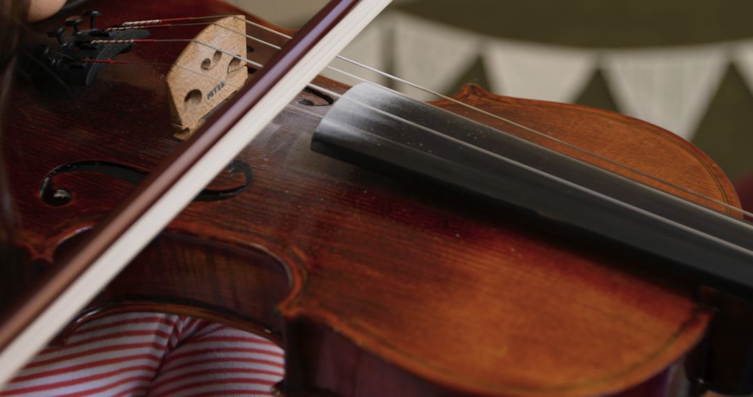 Close-up of Hand Playing Violin, Focusing on String and Bow - Free Images, Stock Photos and Pictures on Pikwizard.com