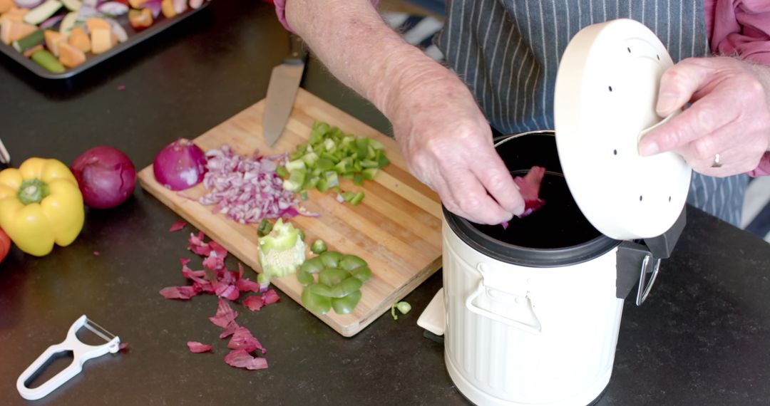 Senior Couple Composting Vegetable Peels at Home