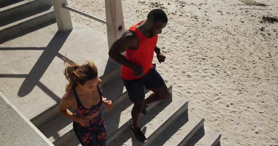 Fitness Enthusiasts Running on Beach Stairs for Workout - Free Images, Stock Photos and Pictures on Pikwizard.com