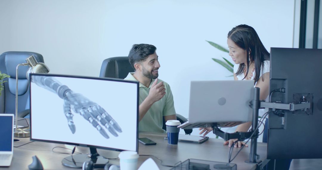 Tech Team Discussing Robotics Innovation in Modern Workspace