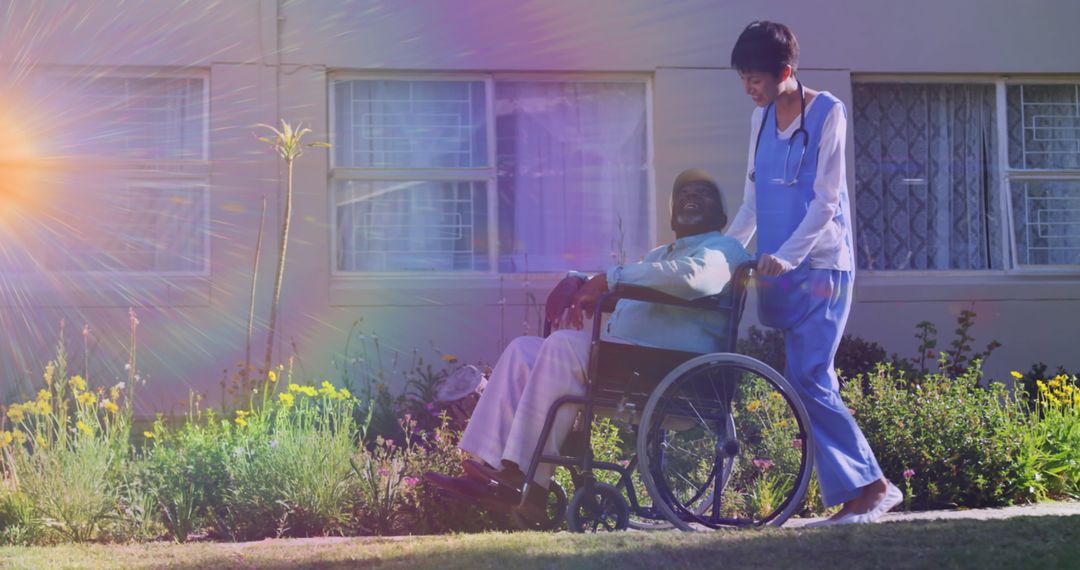 Young Caregiver Assisting Elderly Man Outdoors in Sunny Weather