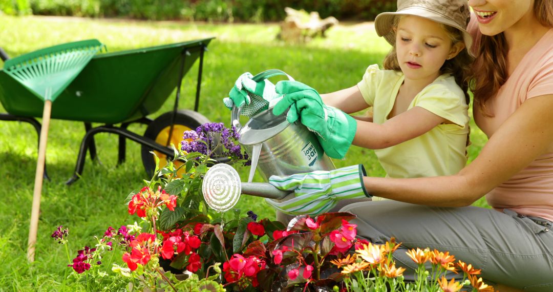 Mother and Child Gardening in Sunny Backyard with Colorful Flowers - Free Images, Stock Photos and Pictures on Pikwizard.com