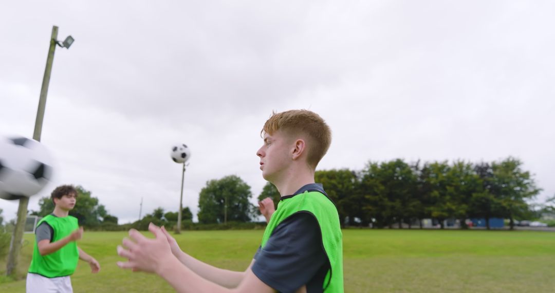 Teen Soccer Players Practicing Passing Techniques on Field