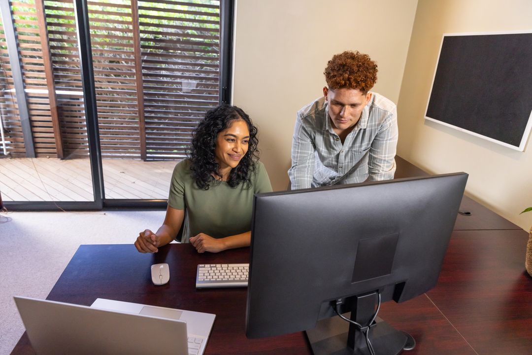 Diverse Coworkers Collaborating in a Modern Home Office Environment