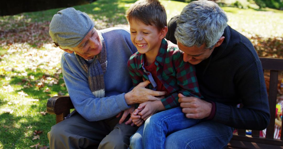 Three Generations laughing Together in Outdoor Park - Free Images, Stock Photos and Pictures on Pikwizard.com