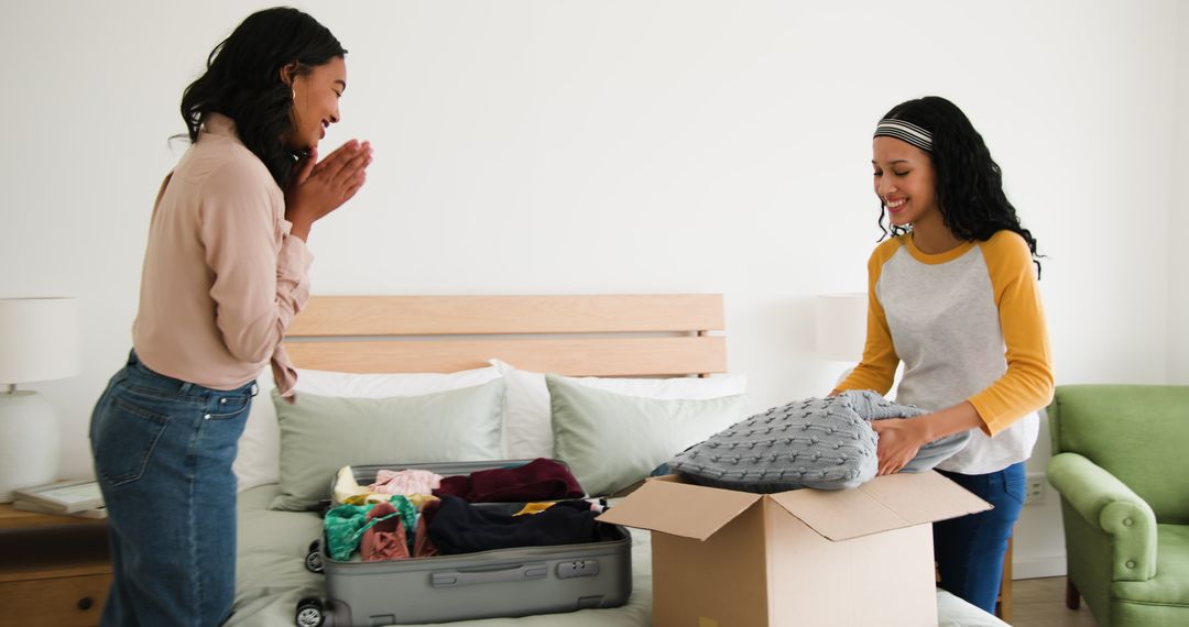 Mother and Daughter Packing and Bonding at Home