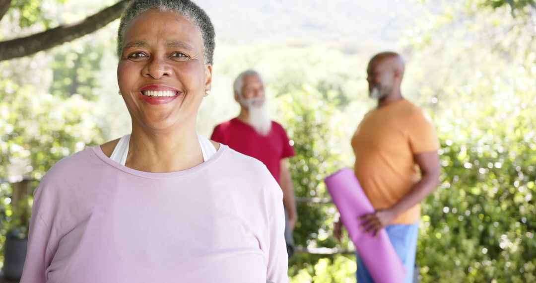 Elderly Friends Smiling and Exercising Outdoors with Yoga Mats - Free Images, Stock Photos and Pictures on Pikwizard.com