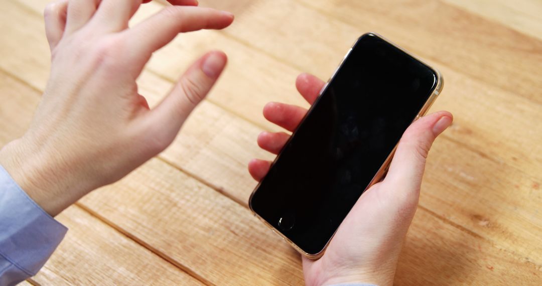 Person Gesturing While Holding Smartphone with Black Screen - Free Images, Stock Photos and Pictures on Pikwizard.com