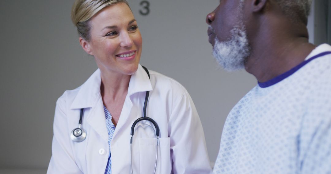 Friendly Doctor Communicating with Elderly Patient in Hospital - Free Images, Stock Photos and Pictures on Pikwizard.com